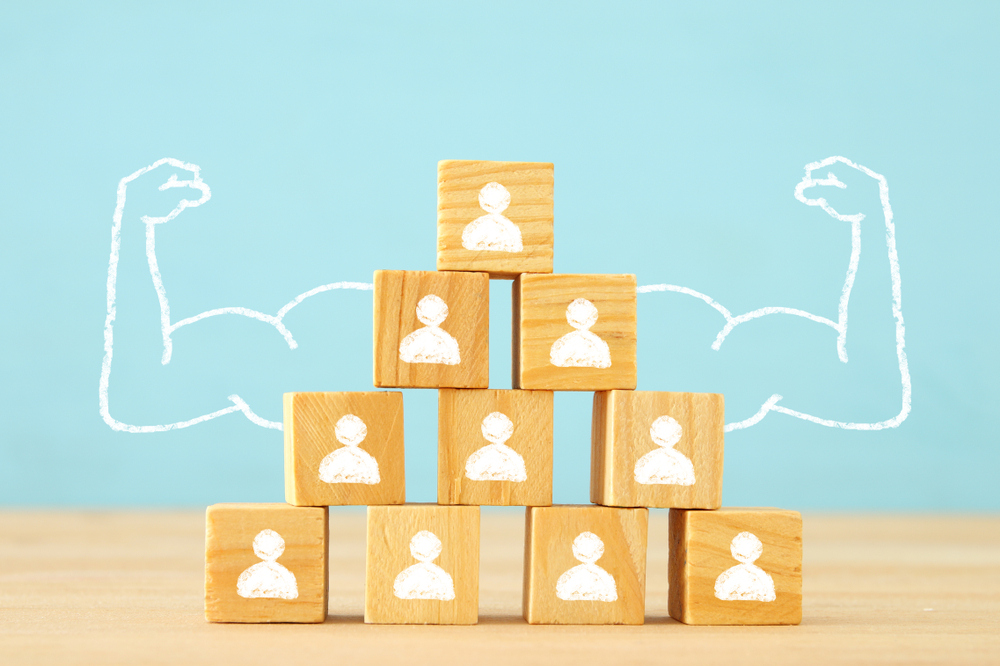 Image Of Wooden Blocks With People Icons, stacked