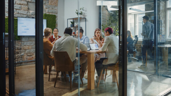 Diverse Group Of Professional Businesspeople Meeting In a Modern Office