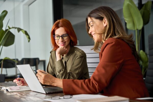 Employees Working Together Using Computer